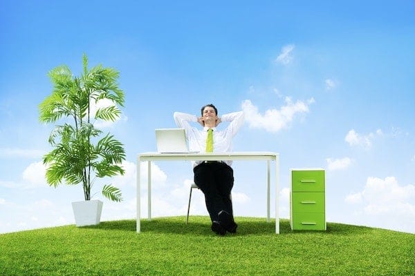 Man Sitting In Office But Outside