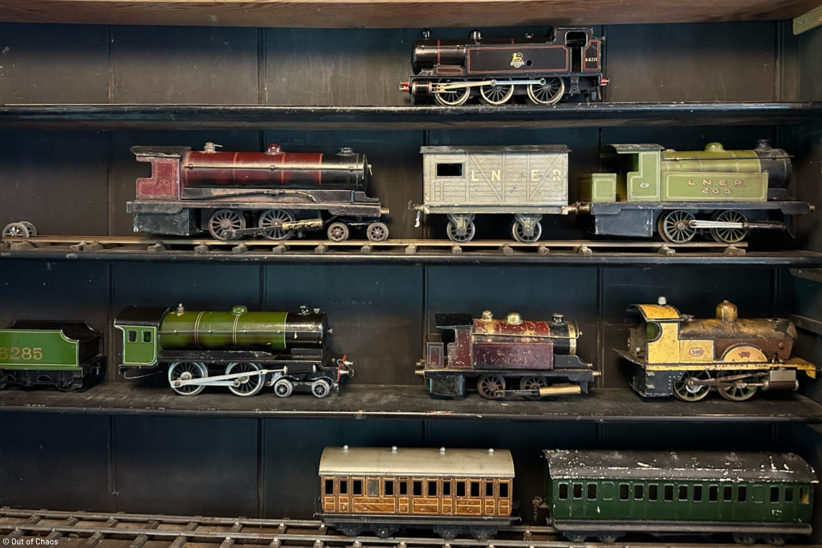 vintage model trains displayed on a shelf
