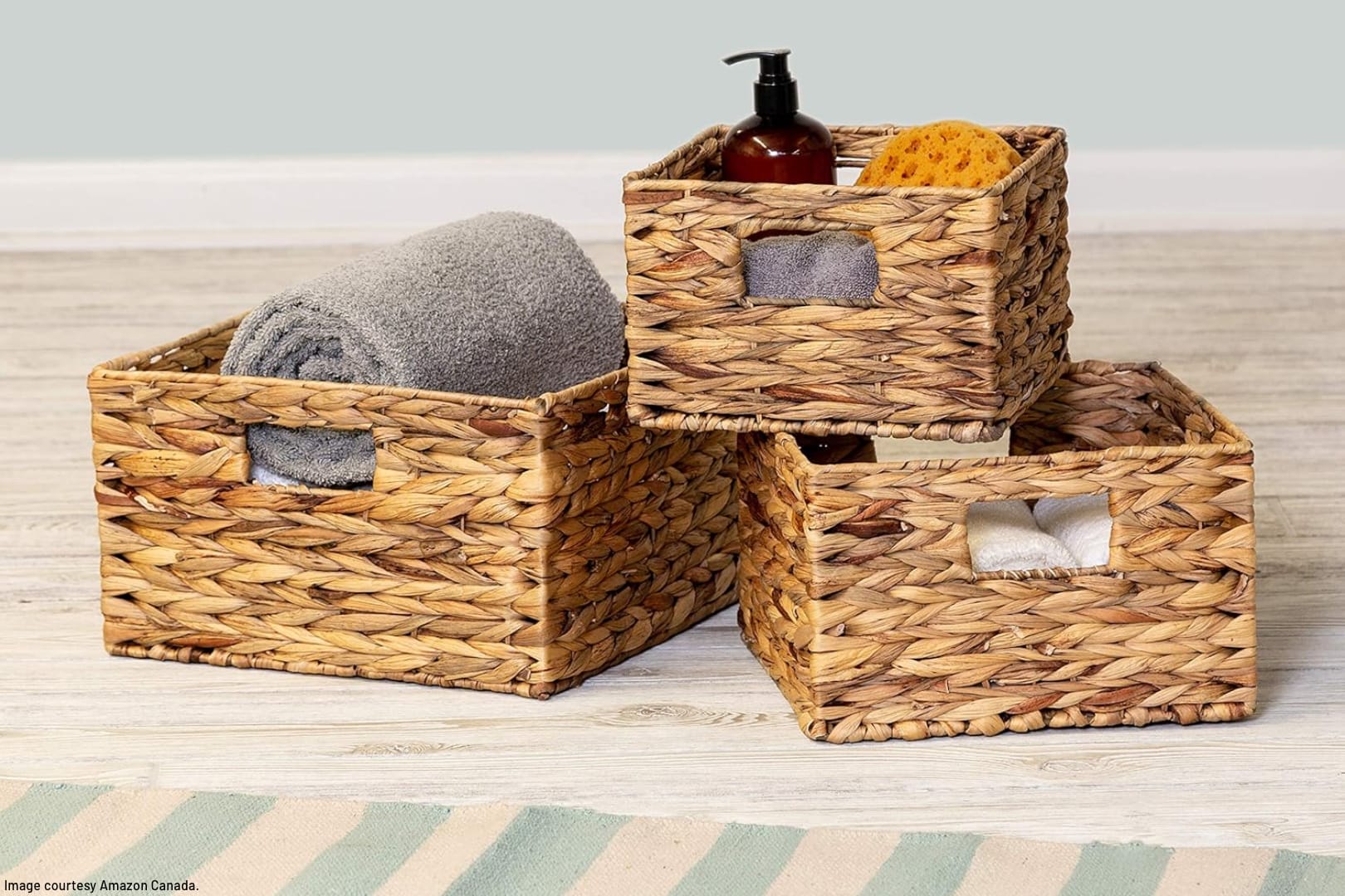 woven seagrass baskets containing towels and personal care supplies
