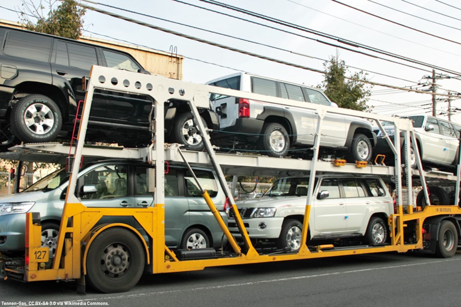 a large truck loaded with cars and SUVs for shipping long distance