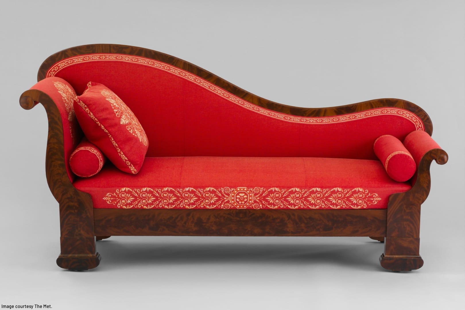 large antique oddly-shaped upholstered sofa made of solid wood